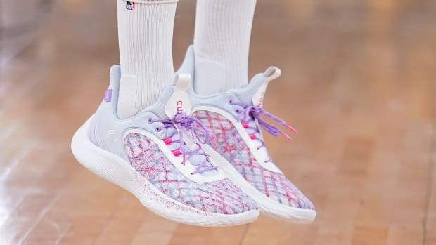Golden State Warriors point guard Stephen Curry wearing the Curry Flow 9 'For the W'.